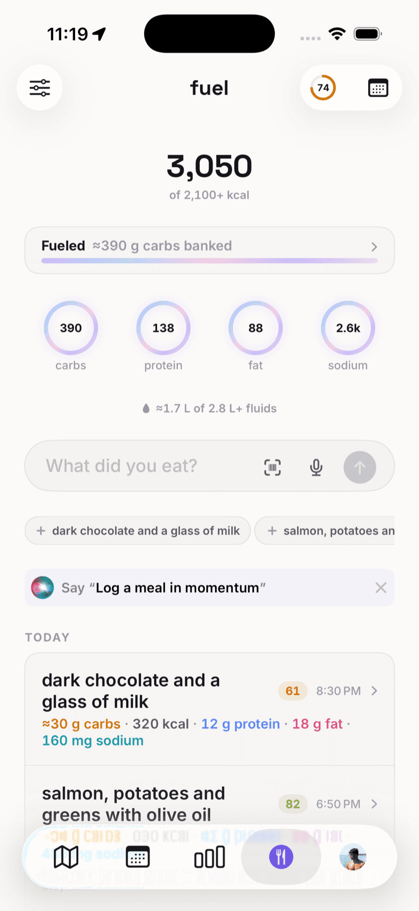 Momentum's Fuel page: calories and carbs banked for tomorrow's session, macro rings, and meals logged in plain language.